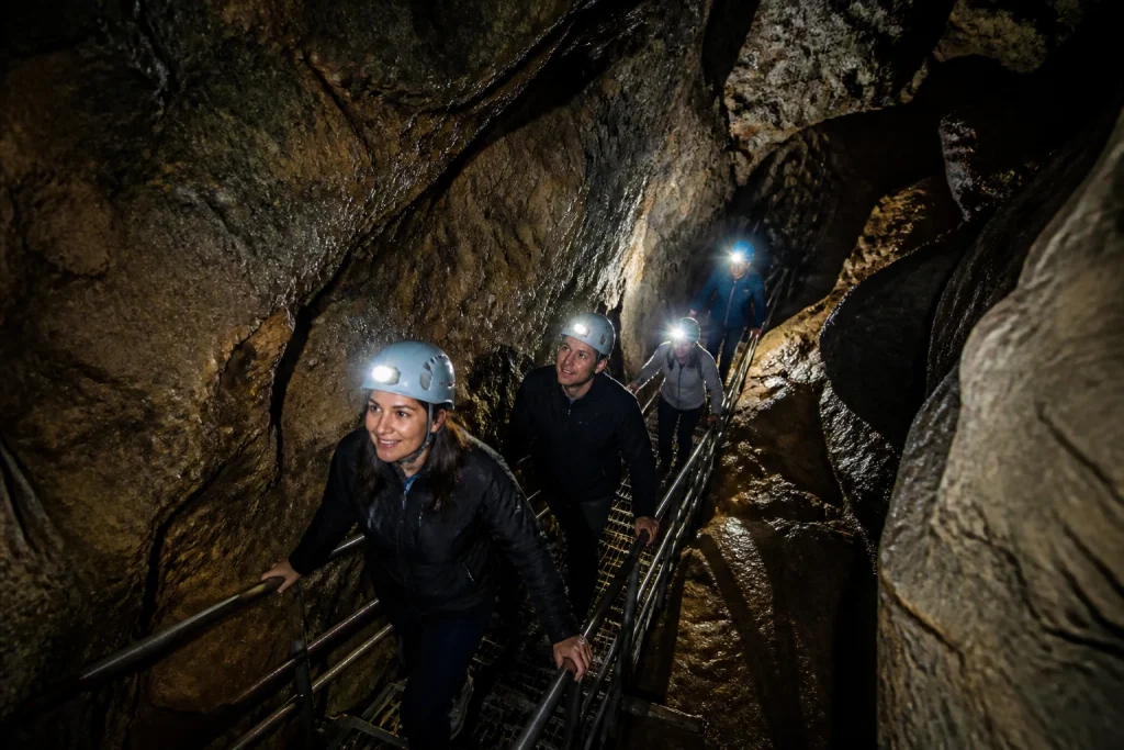 Steep stairs and uneven rock on a guided Riverbend cave tour